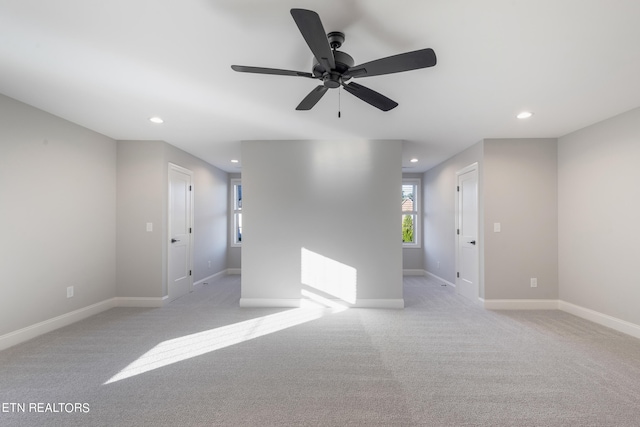 carpeted empty room with ceiling fan