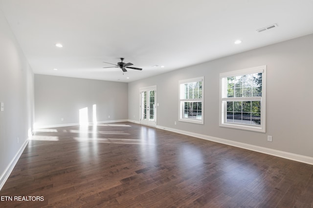 spare room featuring french doors, dark hardwood / wood-style flooring, and ceiling fan