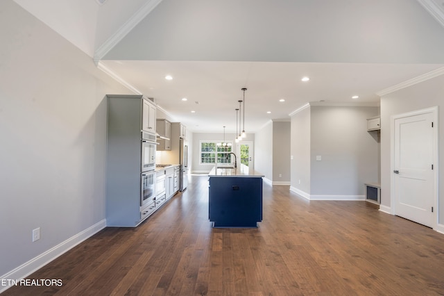 kitchen with gray cabinets, pendant lighting, dark wood-type flooring, a center island with sink, and sink