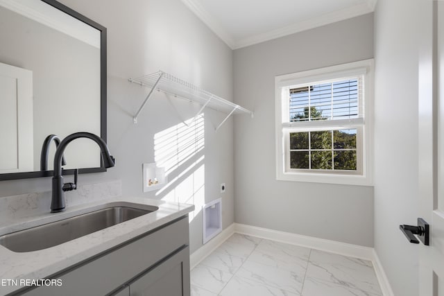 washroom featuring cabinets, crown molding, hookup for an electric dryer, hookup for a washing machine, and sink