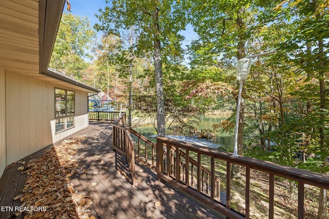 wooden terrace with a water view