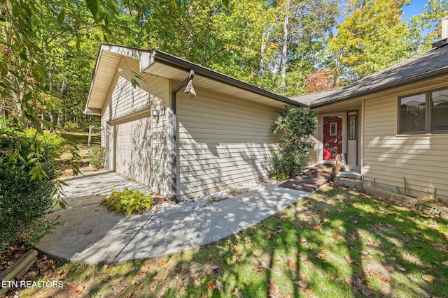 view of property exterior featuring a garage