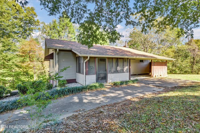 single story home with a sunroom