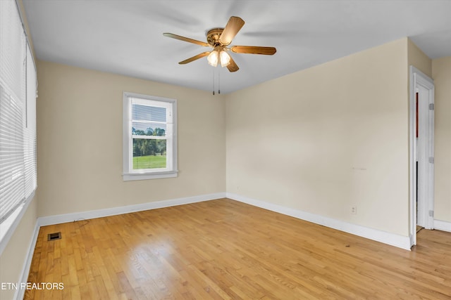 spare room featuring ceiling fan and light hardwood / wood-style floors