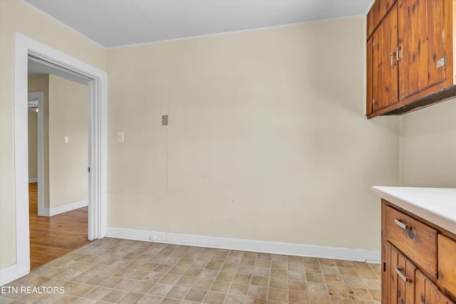 laundry area with light hardwood / wood-style floors