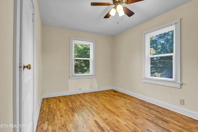 unfurnished room with light wood-type flooring and ceiling fan