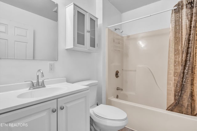 full bathroom with shower / bath combo, vanity, and toilet