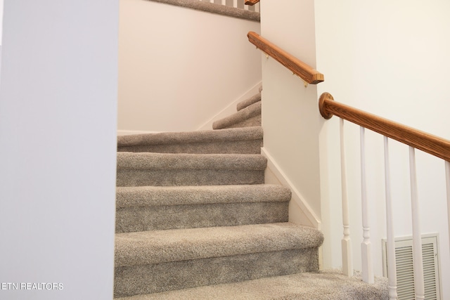 stairs with carpet floors