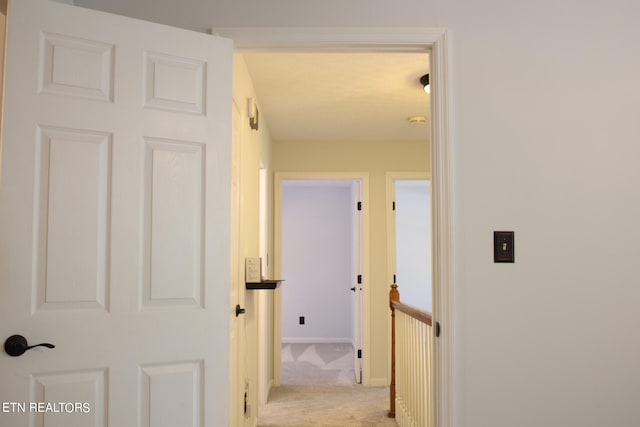 hallway with light carpet