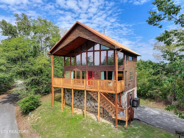 exterior space featuring a sunroom