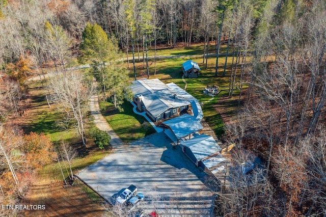 drone / aerial view with a view of trees