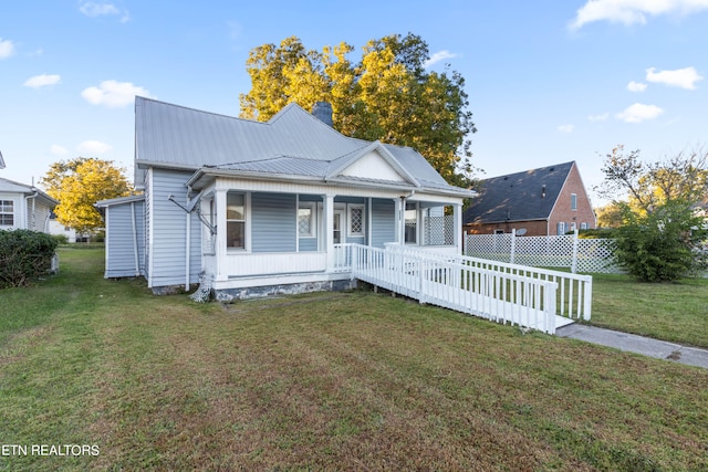 view of front of home featuring a front lawn and a porch