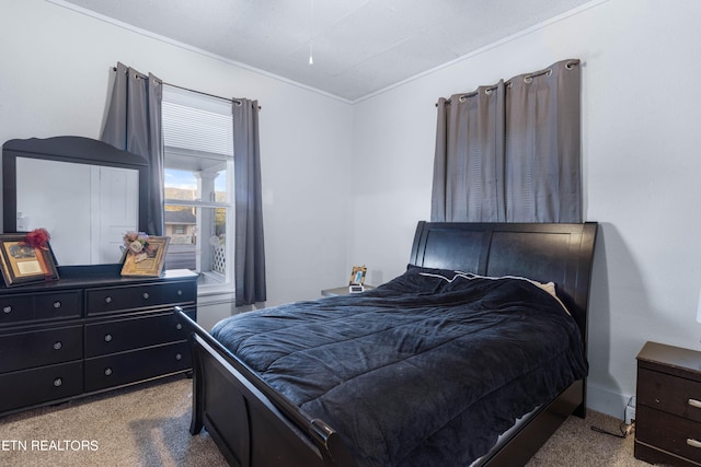 carpeted bedroom featuring ornamental molding