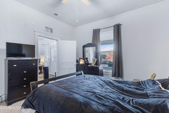 bedroom featuring ornamental molding, carpet flooring, and ceiling fan