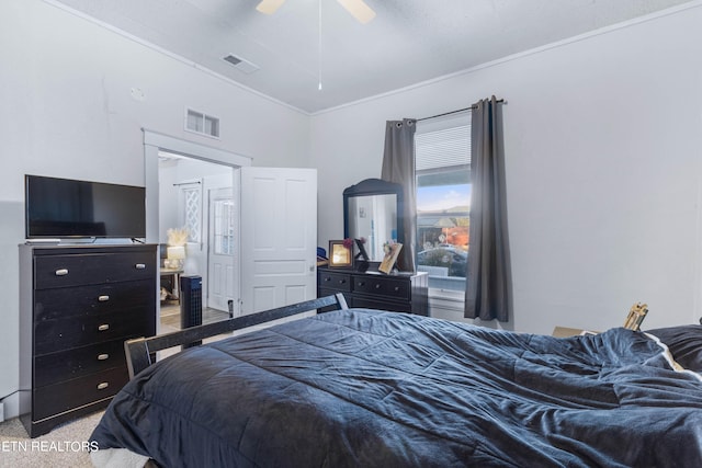 bedroom featuring crown molding, light colored carpet, ceiling fan, and visible vents