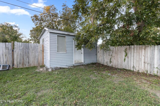 view of shed featuring a fenced backyard