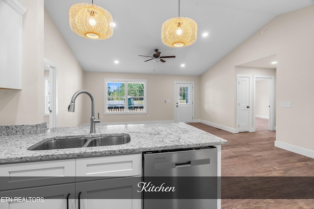 kitchen with dishwasher, vaulted ceiling, dark hardwood / wood-style flooring, and white cabinetry