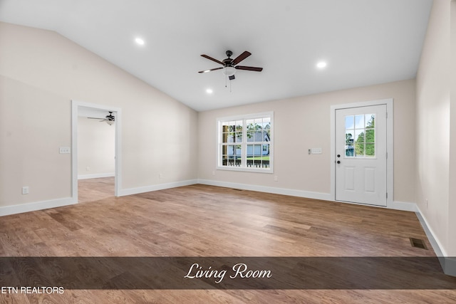 entrance foyer with lofted ceiling, plenty of natural light, wood-type flooring, and ceiling fan