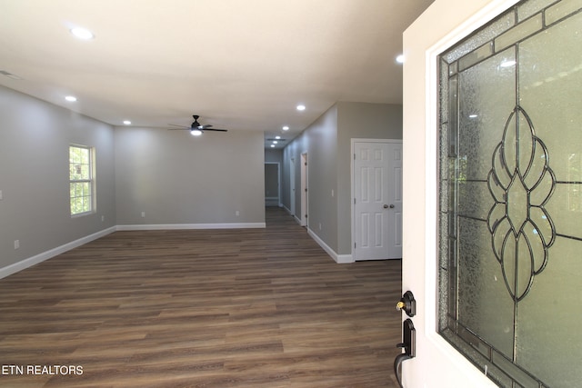 spare room with dark hardwood / wood-style floors and ceiling fan