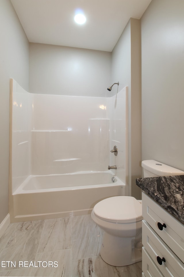 full bathroom featuring toilet, vanity, and  shower combination