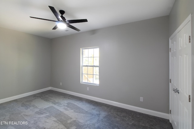 empty room with carpet floors and ceiling fan