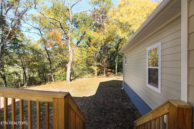 view of yard featuring a wooden deck