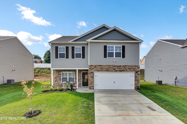 craftsman-style house featuring a garage, cooling unit, and a front yard