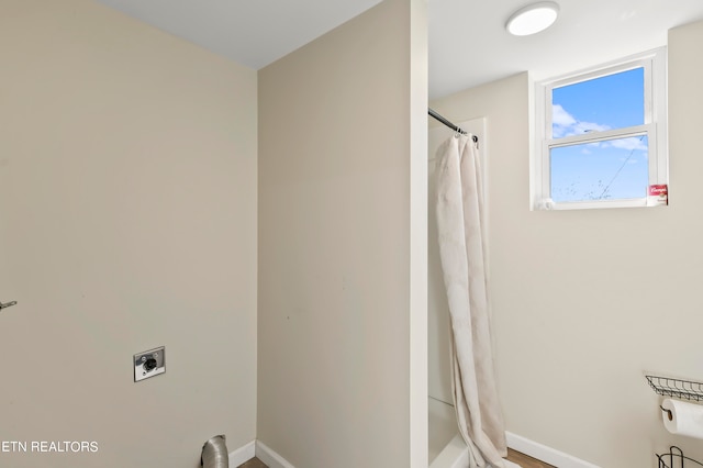 bathroom with curtained shower