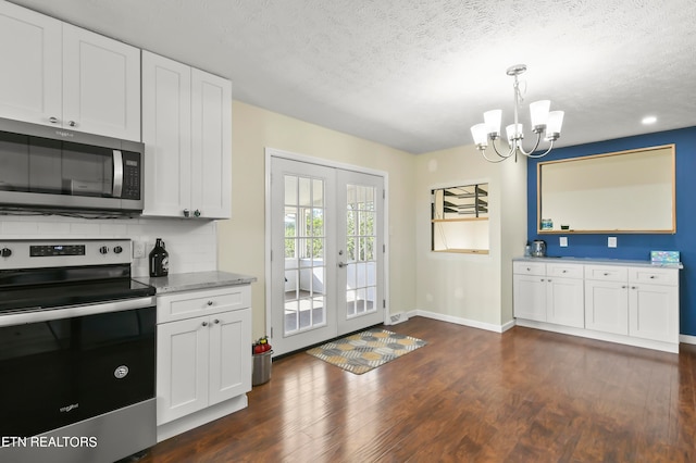 kitchen with french doors, stainless steel appliances, dark hardwood / wood-style flooring, and white cabinetry