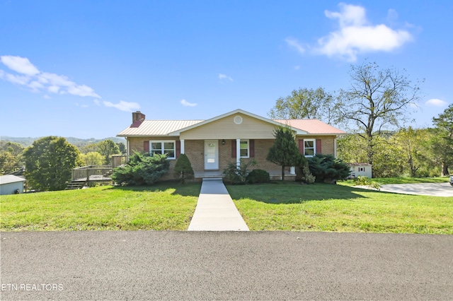 view of front of house with a front lawn