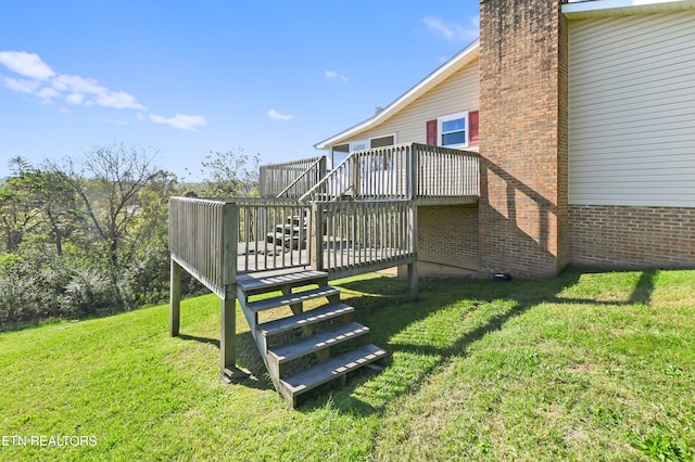 exterior space featuring a deck and a yard