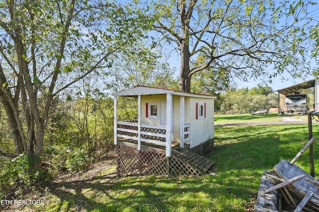 view of outbuilding with a lawn