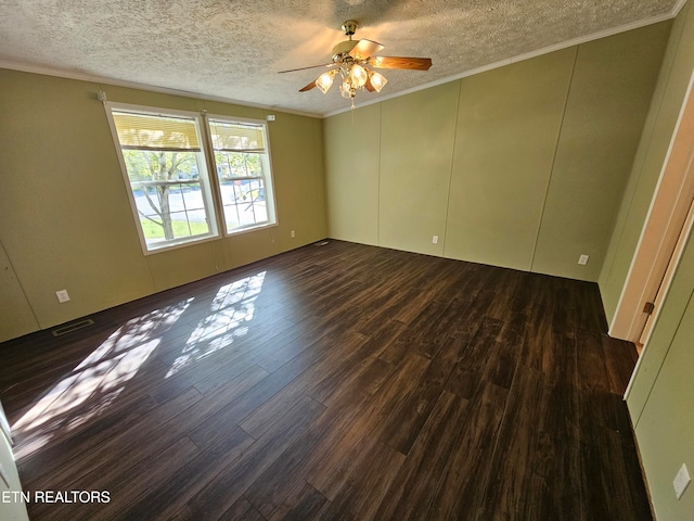 spare room featuring crown molding, dark hardwood / wood-style floors, ceiling fan, and a textured ceiling