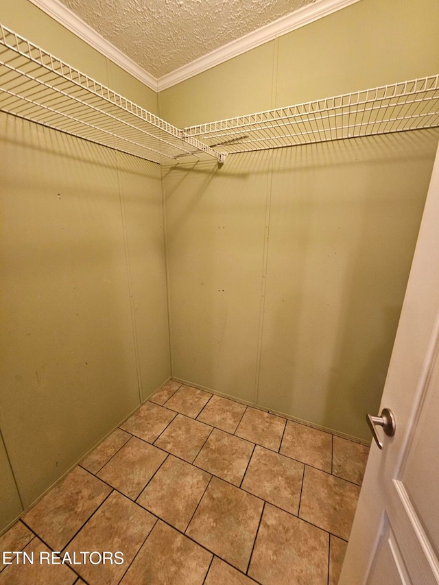 spacious closet featuring light tile patterned flooring