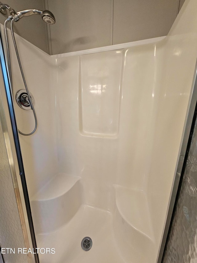 bathroom featuring walk in shower