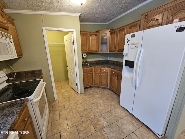 kitchen with ornamental molding, light tile patterned floors, a textured ceiling, and white appliances