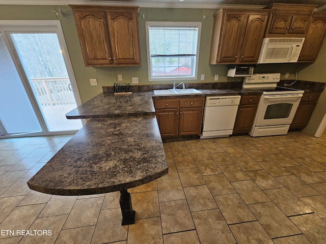 kitchen with sink and white appliances