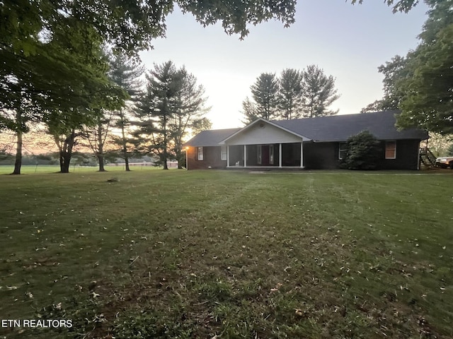 view of yard at dusk