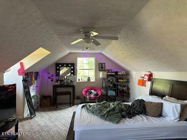 carpeted bedroom with ceiling fan, a textured ceiling, and lofted ceiling