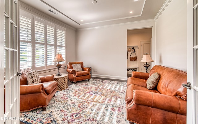 living room featuring french doors and crown molding