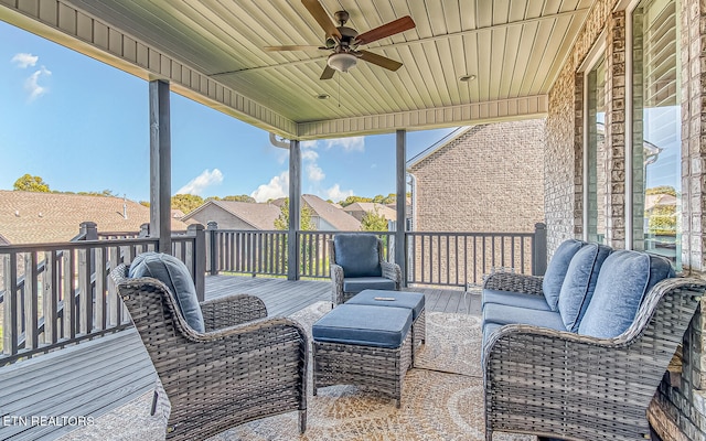 deck featuring outdoor lounge area and ceiling fan