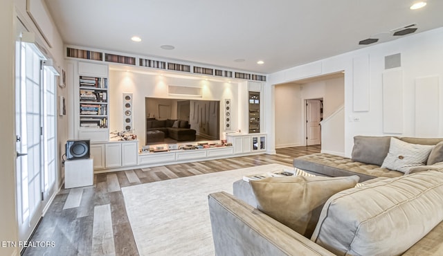 living room with hardwood / wood-style flooring and a wealth of natural light