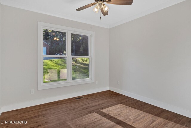 spare room with crown molding, ceiling fan, and dark hardwood / wood-style flooring