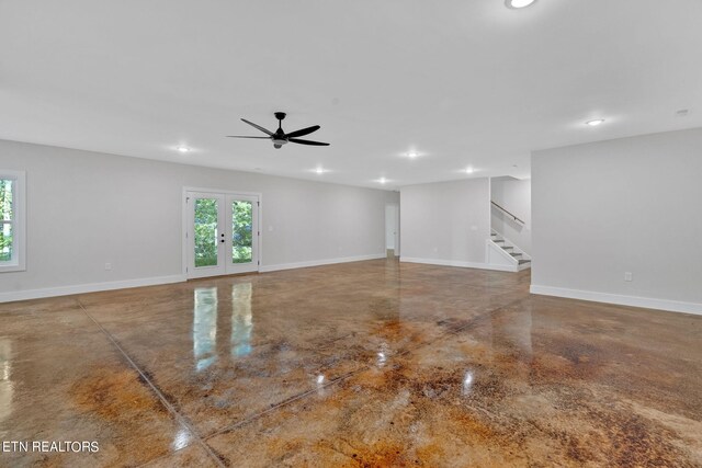 empty room featuring french doors and ceiling fan