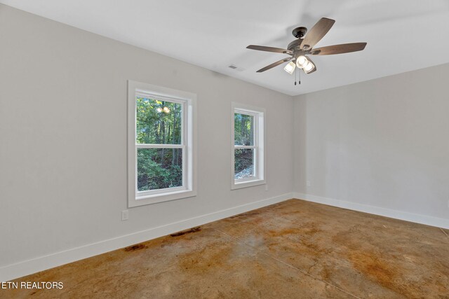 spare room featuring ceiling fan and carpet flooring