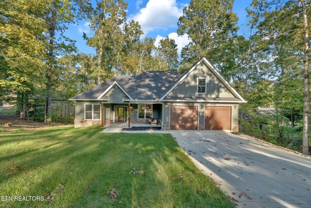 craftsman-style house featuring a garage and a front lawn