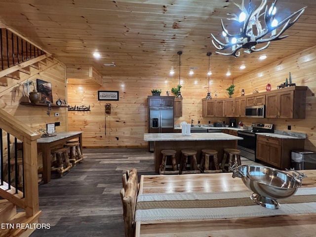 dining room with wooden walls, wood ceiling, and dark hardwood / wood-style flooring