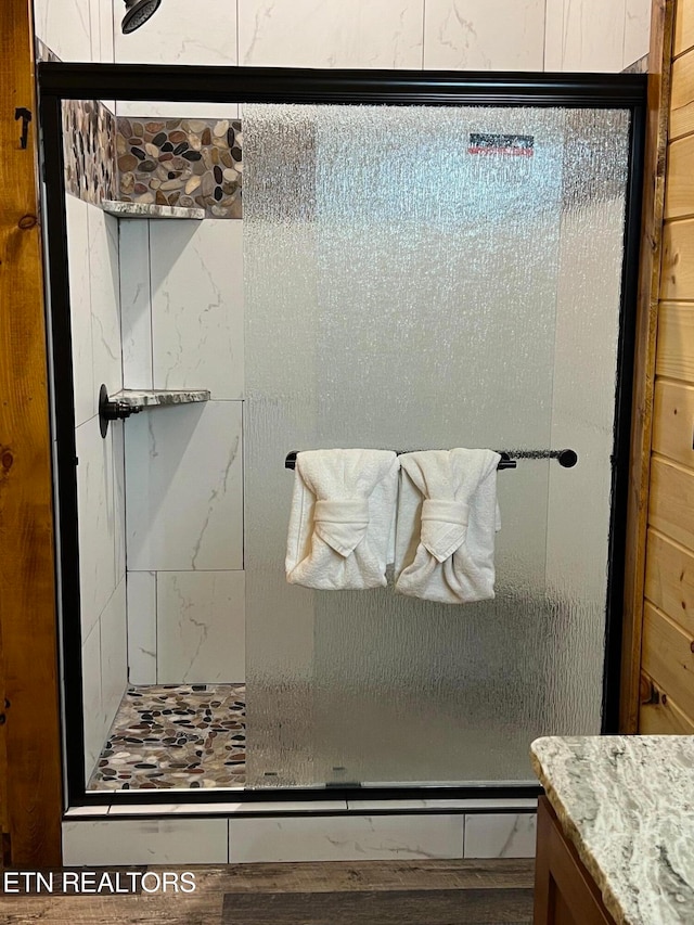 bathroom with vanity and an enclosed shower