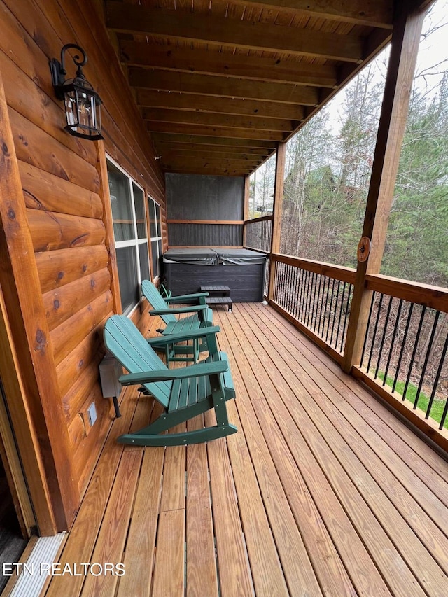 deck with a hot tub