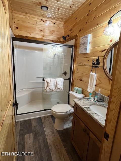 bathroom with walk in shower, vanity, wood ceiling, hardwood / wood-style flooring, and toilet